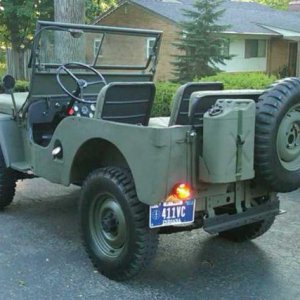 Rear mounted Jerry can and Spare.  Military look and mounts.