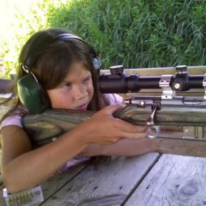 My 9 year old showing what this little rimfire sniper can do at 100 yds.  She felt more comfortable using two fingers to pull the trigger, since this 