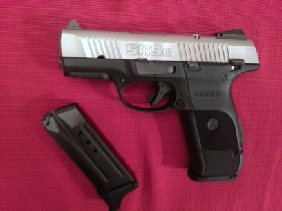 SR9c two mags; large capacity mag with grip extension; compact mag has pierce finger extension